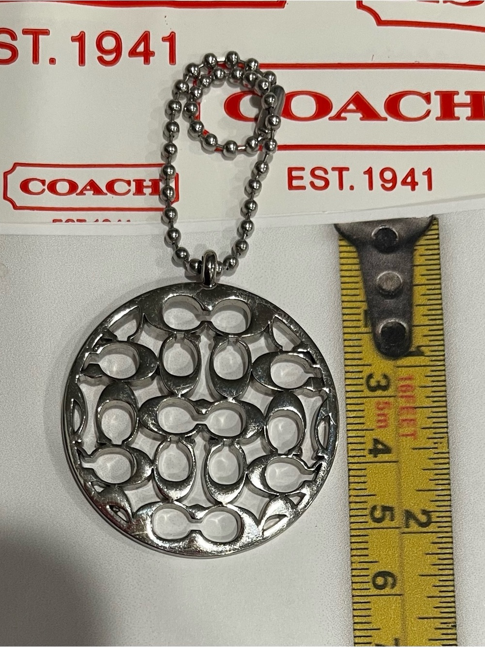 Coach Silver-Tone Signature Miranda Cutout Pendant/Hangtag